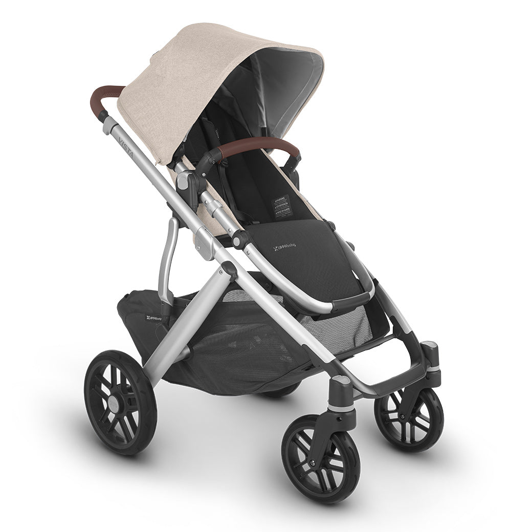 The half extended sunshade on the left side view of uppababy vista v2 stroller -- Color_Declan
