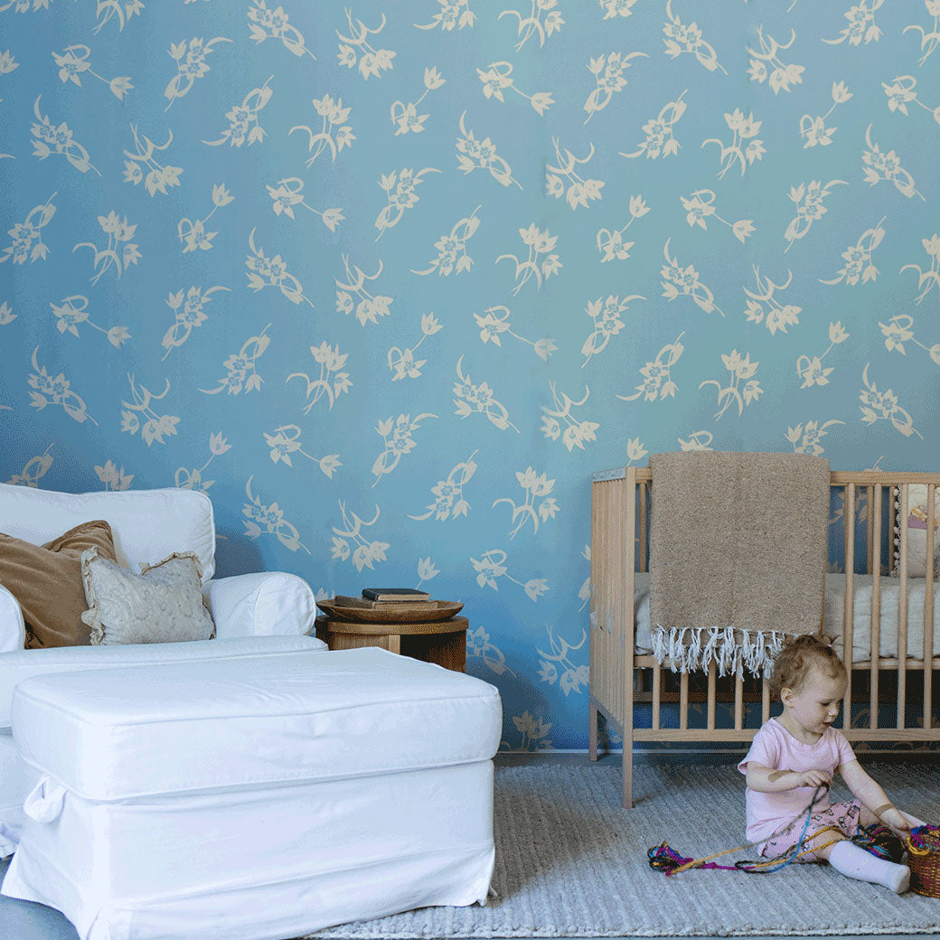 A child playing in a room furnished with the Anewall After The Rain Floral Mural