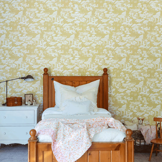 Lifestyle front view of bed in a room furnished with Anewall Forest Floor Mushroom Wallpaper