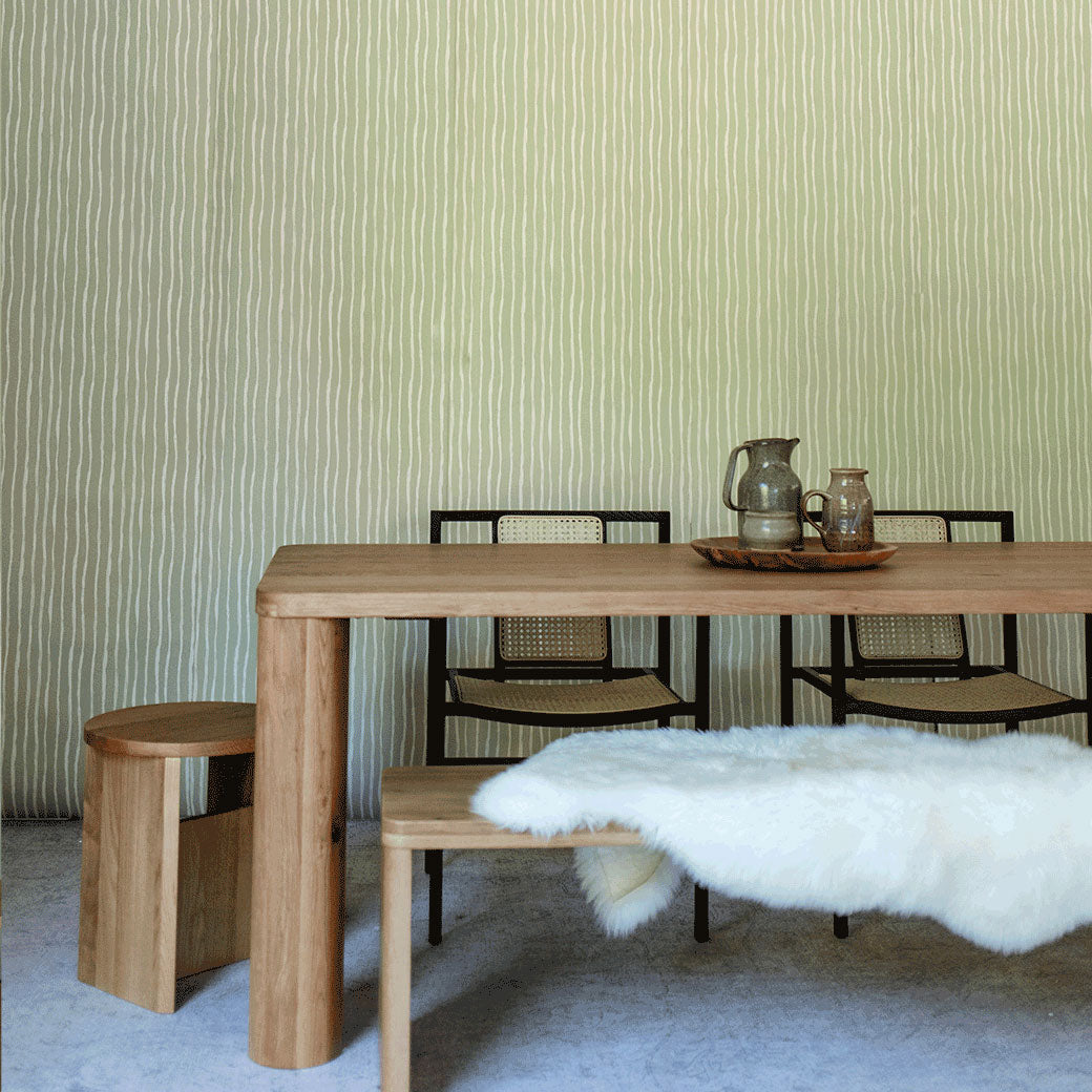 Left corner view of table with chairs in front of Anewall Soft Stripes Wallpaper