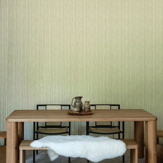 Lifestyle front view of table with chairs in front of Anewall Soft Stripes Wallpaper