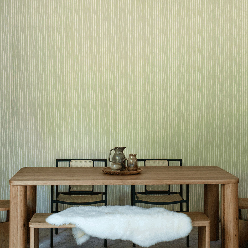 Lifestyle front view of table with chairs in front of Anewall Soft Stripes Wallpaper