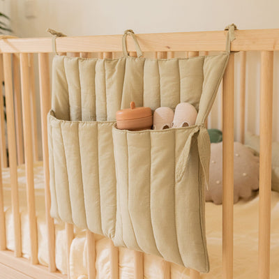 Lorena Canals Benjamin Pocket Hanger on a crib in -- Color_Olive