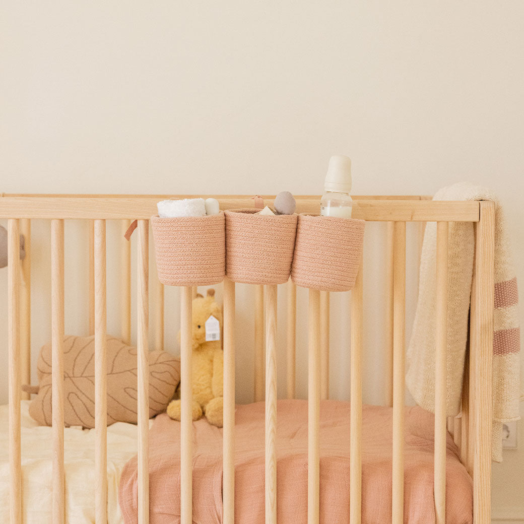 Lifestyle view of Lorena Canals Bobby Crib Basket on a crib  in -- Color_Vintage Nude