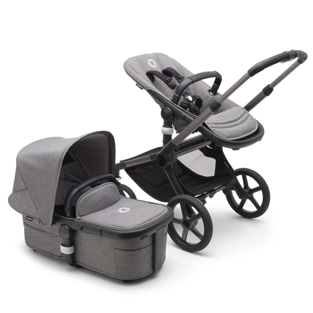 Bugaboo Fox 5 Stroller with a toddler seat and the bassinet on the side in -- Color_Grey Melange