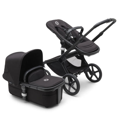 Bugaboo Fox 5 Stroller with a toddler seat and the bassinet on the side in -- Color_Black