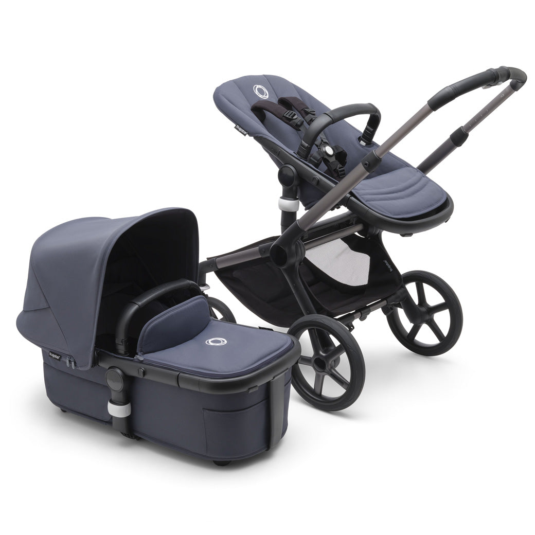 Bugaboo Fox 5 Stroller with a toddler seat and the bassinet on the side in -- Color_Stormy Blue