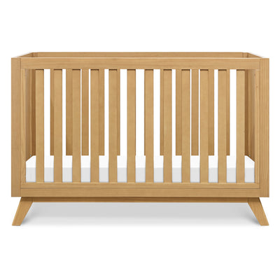 Front view of DaVinci Otto 3-in-1 Convertible Crib in -- Color_Honey _ Wood