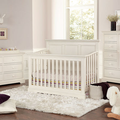 Westwood Design Hanley Convertible Crib next to dresser and window in -- Color_Chalk