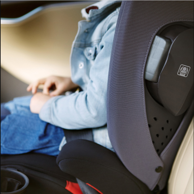 Sideview detail of seat with a child in it of the Nuna AACE Booster Seat in -- Lifestyle