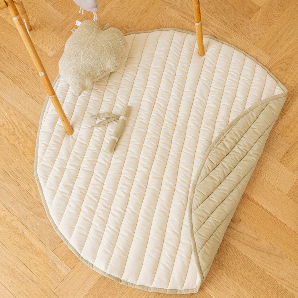 Folded lifestyle view of Lorena Canals Products Bamboo Leaf Playmat