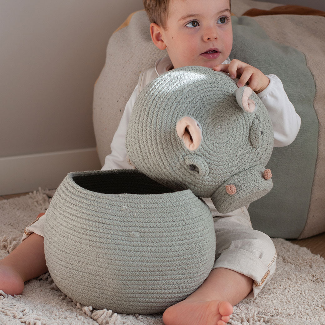 A child playing with the Lorena Canals Henry the Hippo Basket