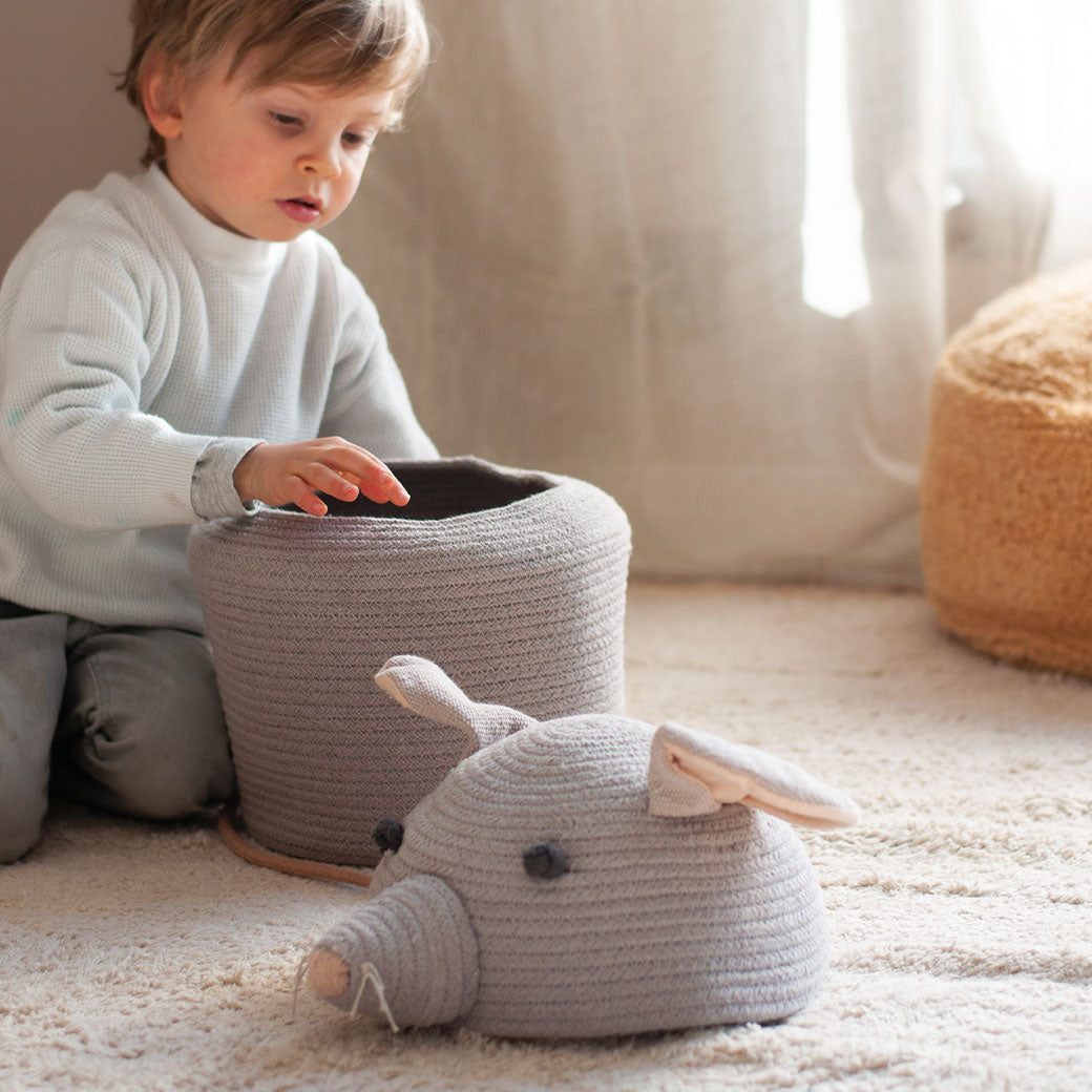 A toddler with the Lorena Canals Renata the Rat Basket