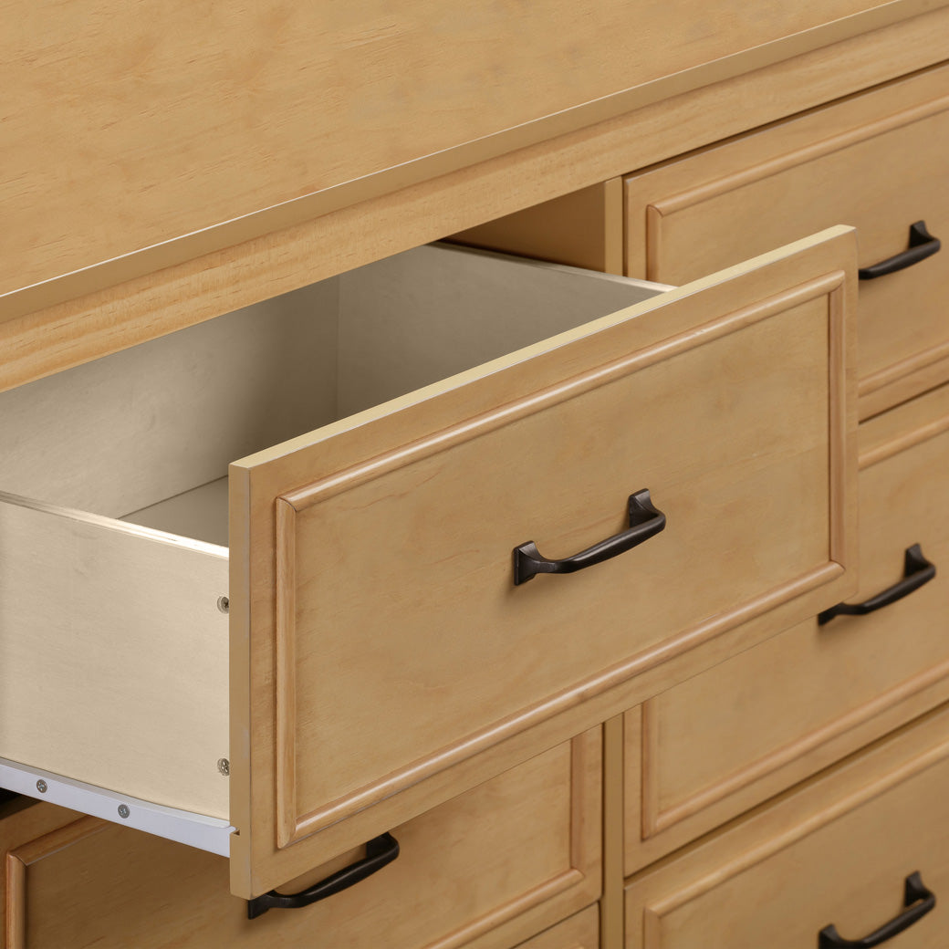 The DaVinci Charlie 6-Drawer Dresser drawer closeup in -- Color_Honey