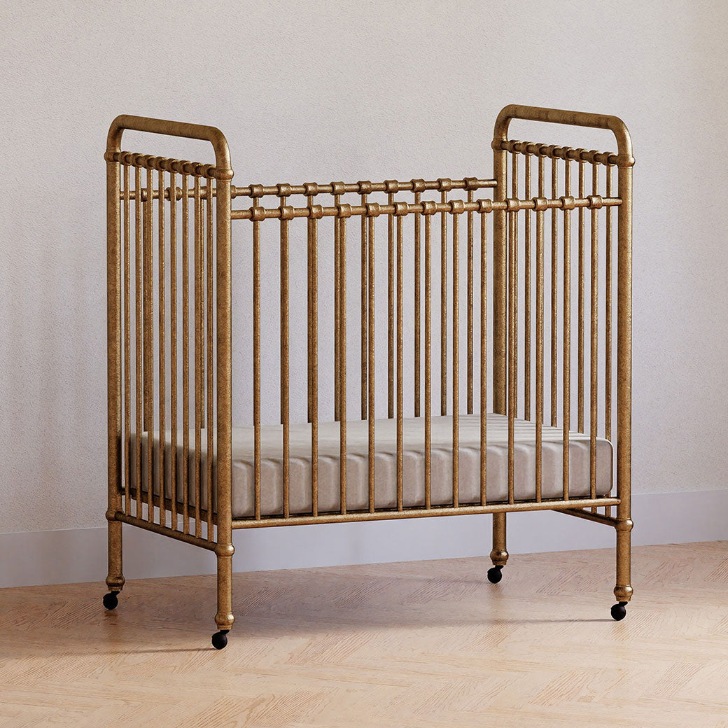 Namesake`s Abigail 3-in-1 Convertible Mini Crib in a room in -- Color_Vintage Gold
