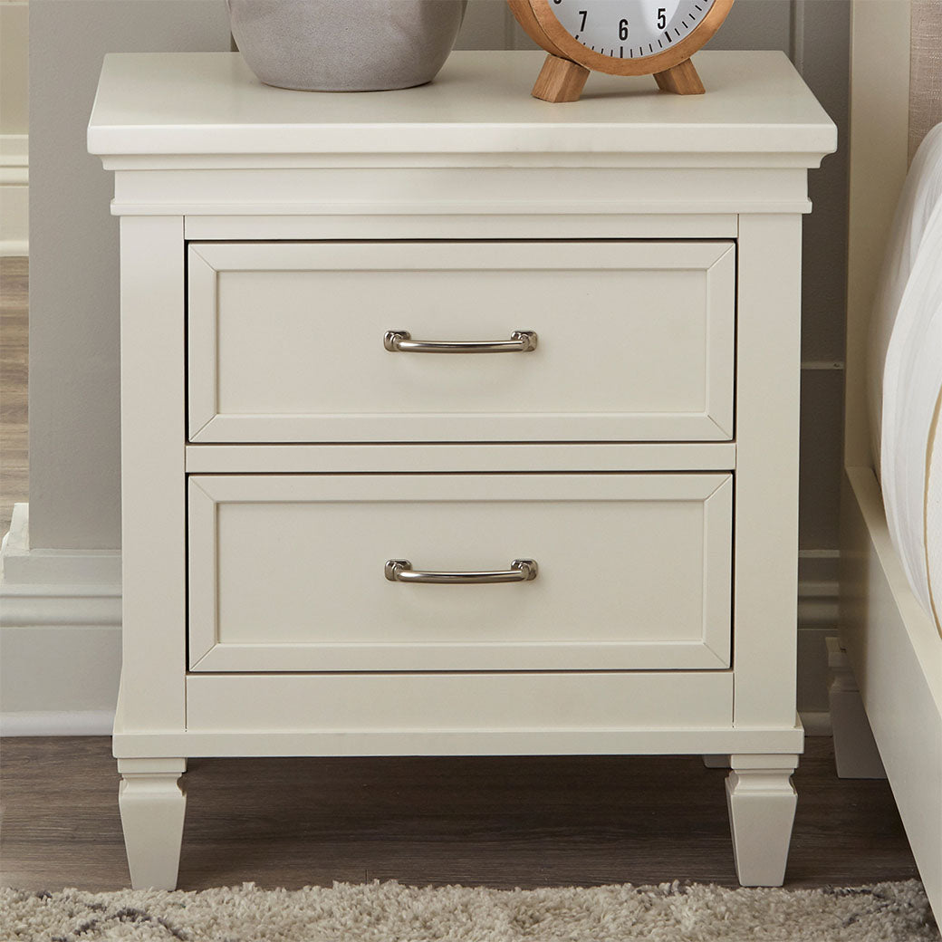 Front view of Namesake's Darlington Assembled Nightstand with items on top in -- Color_Warm White