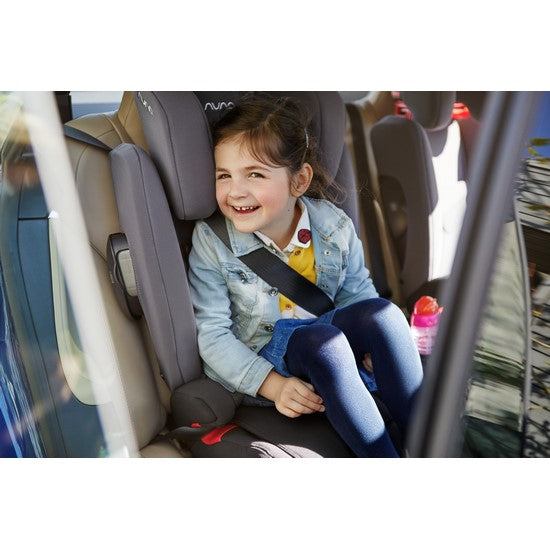 A child sitting inside of a car in the Nuna AACE Booster Seat in -- Color_Lake