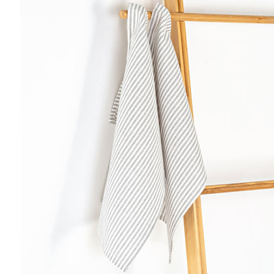 Unfolded Milton & Goose Tea Towels on a hanger  in -- Color_Gray