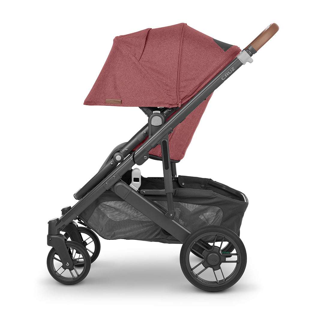 Side view of UPPAbaby CRUZ V2 Stroller with black frame and blush red fabric -- Color_Lucy