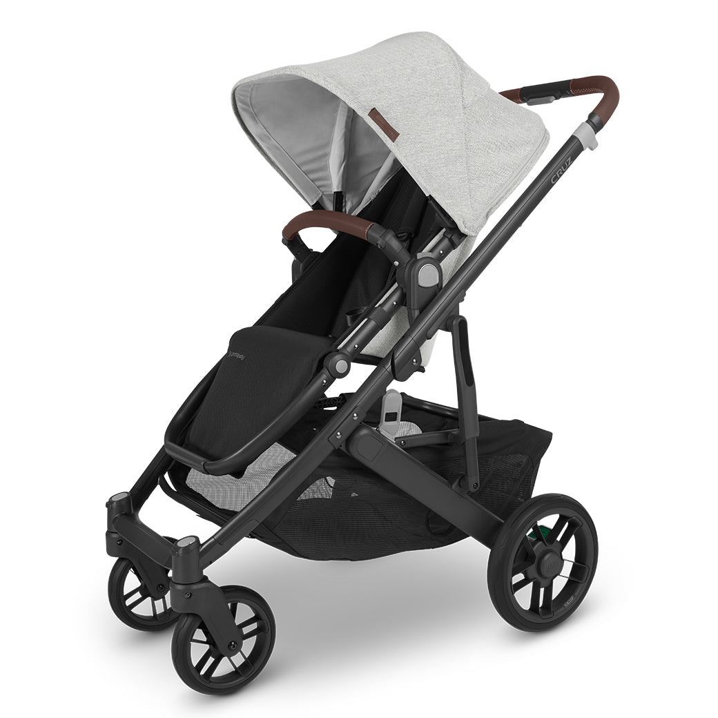 UPPAbaby CRUZ V2 Stroller, angled to the left in a light grey, with the shade up -- Color_Anthony