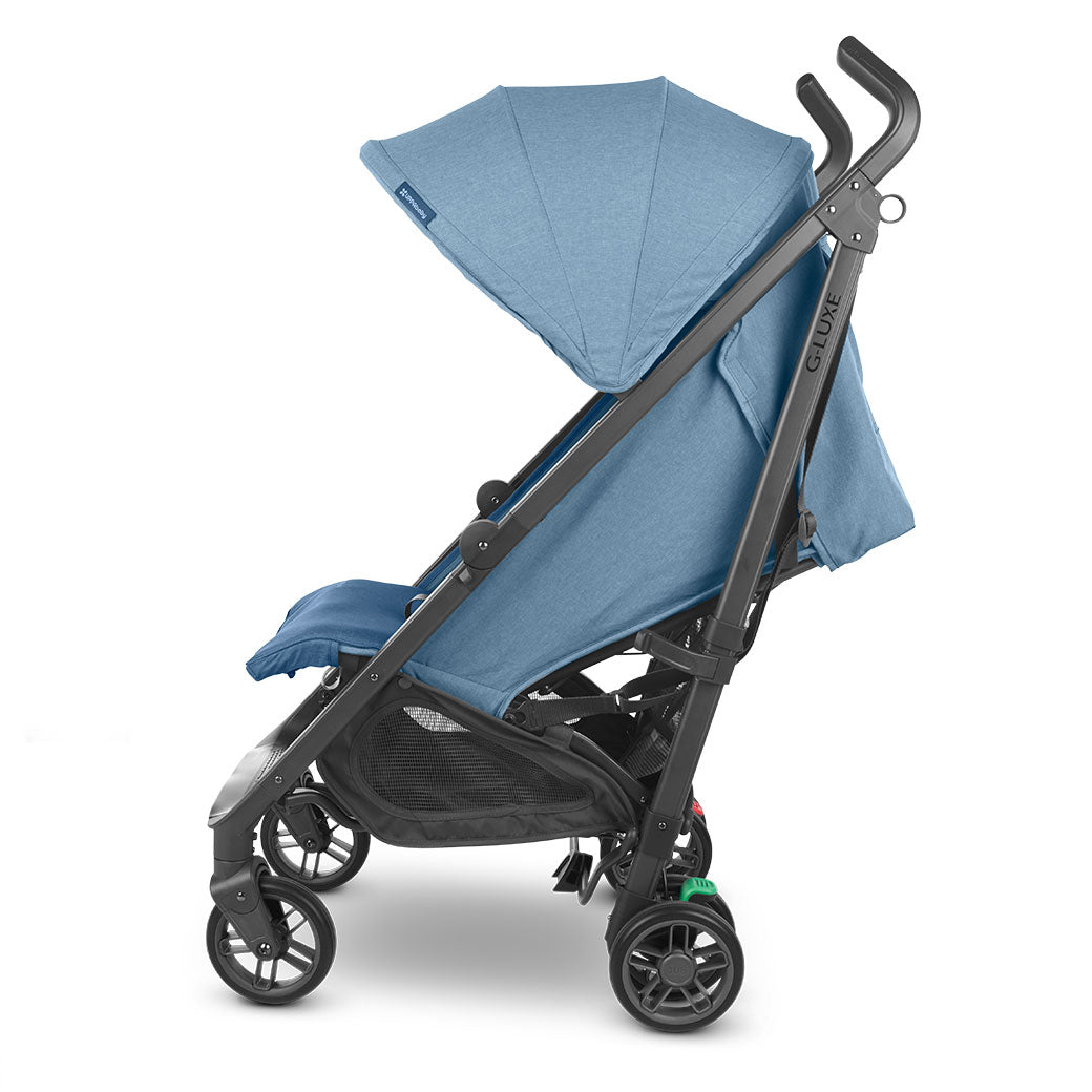 Side view of reclined UPPAbaby G-Luxe Stroller in --Color_Charlotte