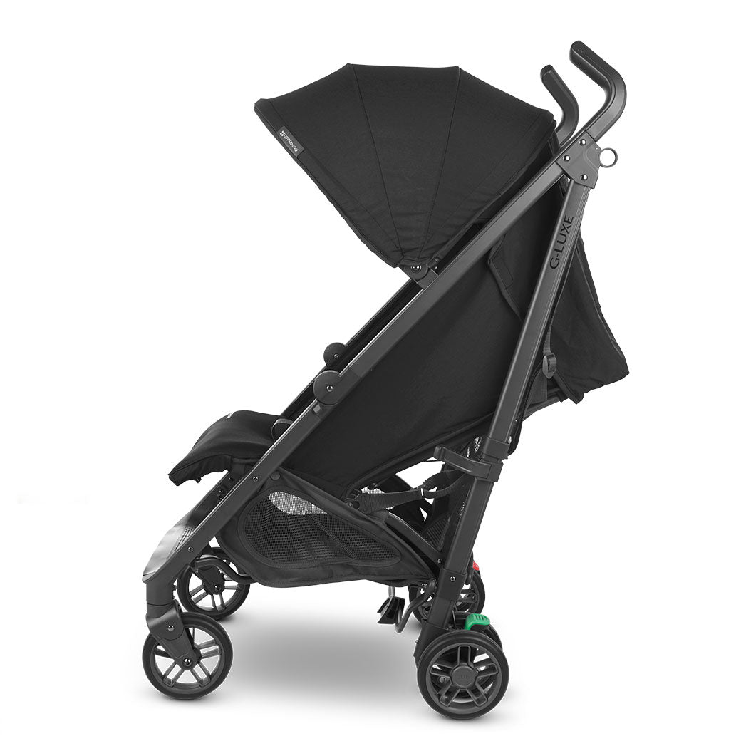 Side view of reclined UPPAbaby G-Luxe Stroller in --Color_Jake