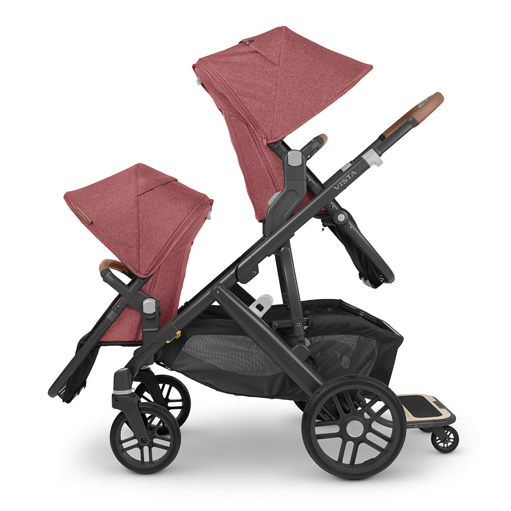 The final configuration of the Vista V2 stroller that grows with your family, showing two seats on the stroller and a piggyback ride-along board to enable 3 children to ride -- Color_Lucy