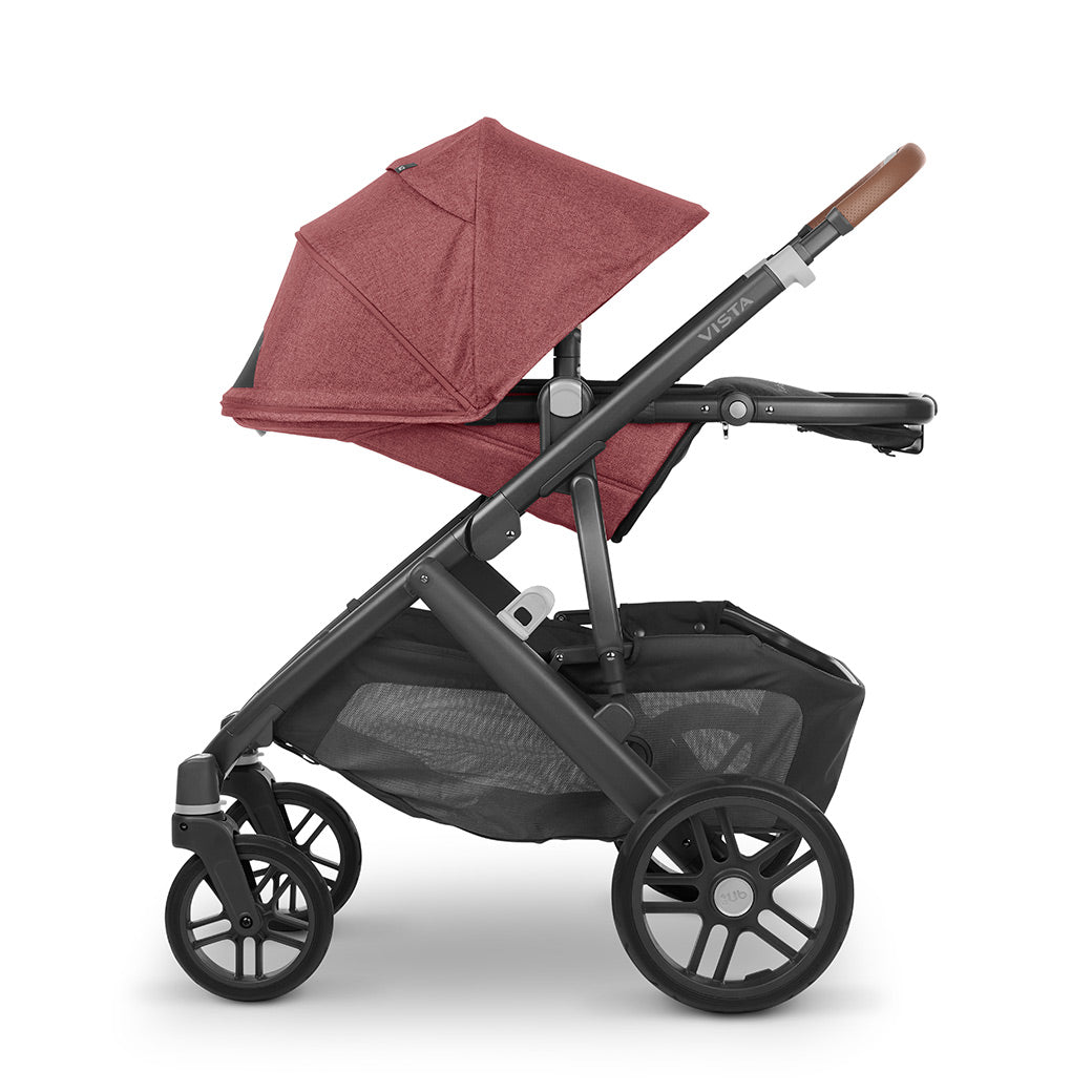 Side view of reversed and reclined UPPAbaby VISTA V2 Travel System stroller in -- Color_Lucy