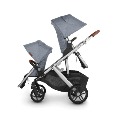 The side of the UPPAbaby Vista V2 Twin Stroller in one seat facing front and one seat facing behind -- Color_Gregory