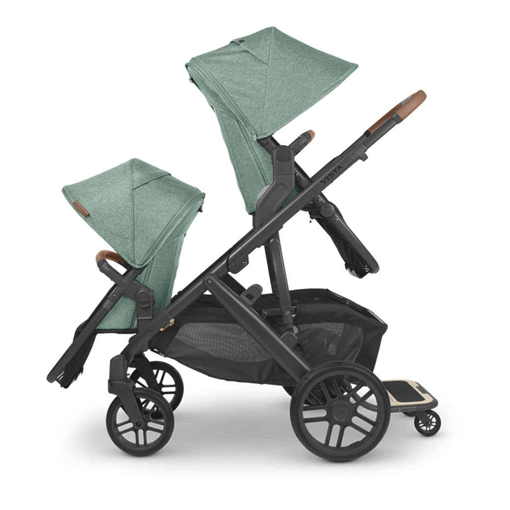 The side of the UPPAbaby Vista V2 Twin Stroller in one seat facing front and one seat facing behind -- Color_Gwen